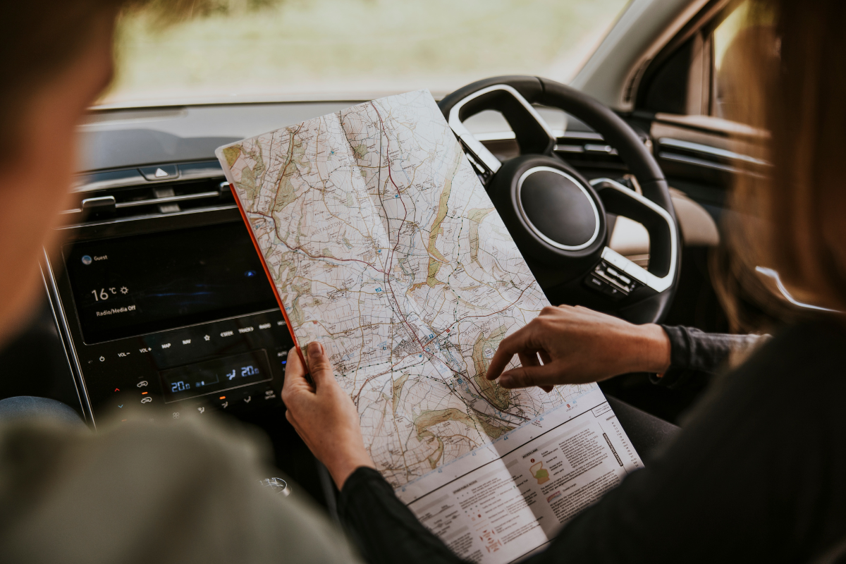 A driver using a map to navigate.
