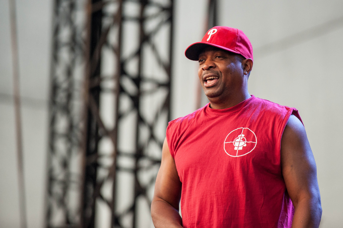 Chuck D performing live on stage.