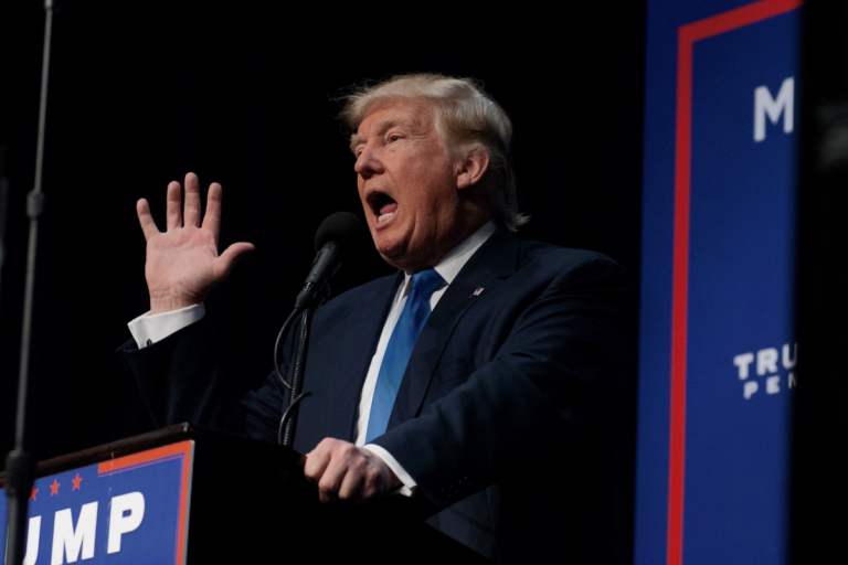 Donald Trump speaking at a press conference.