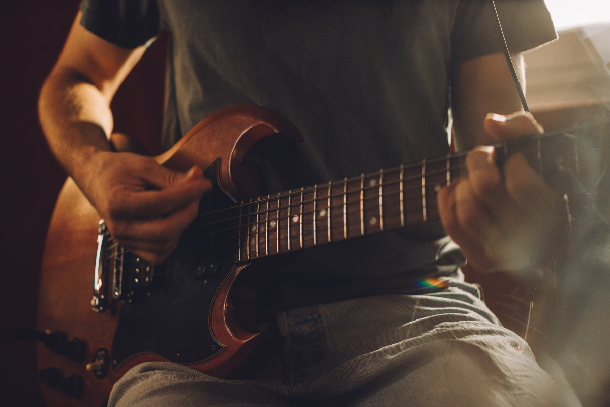 A man playing the guitar.