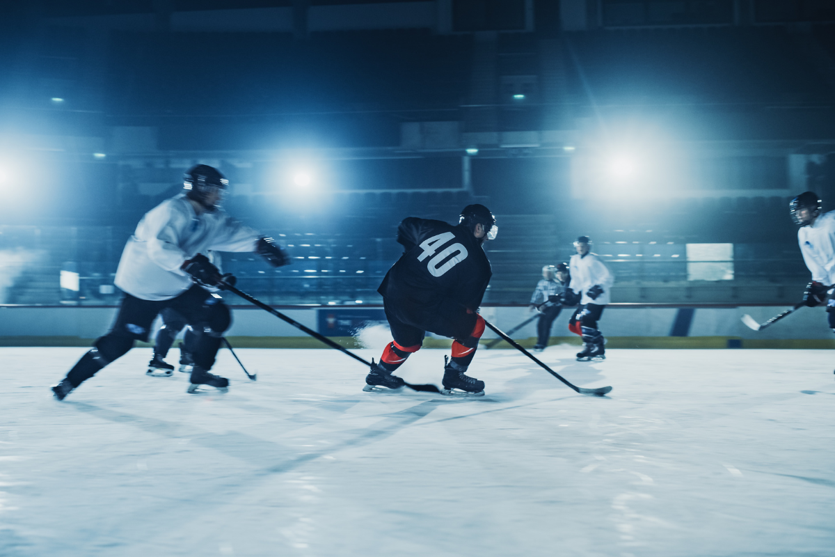 Hockey players skating on the ice.
