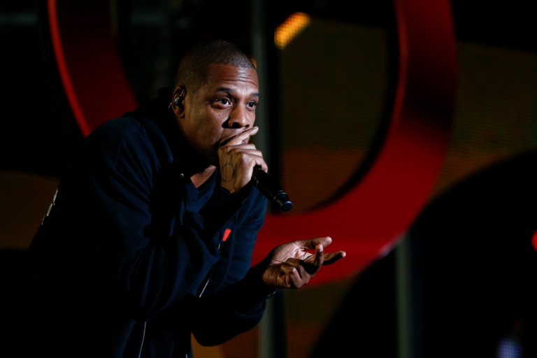Jay-Z performing live on stage.