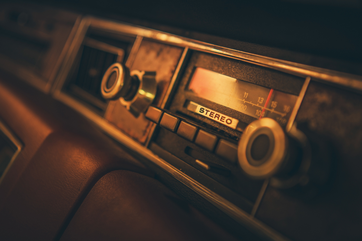 A close up of an old car radio.