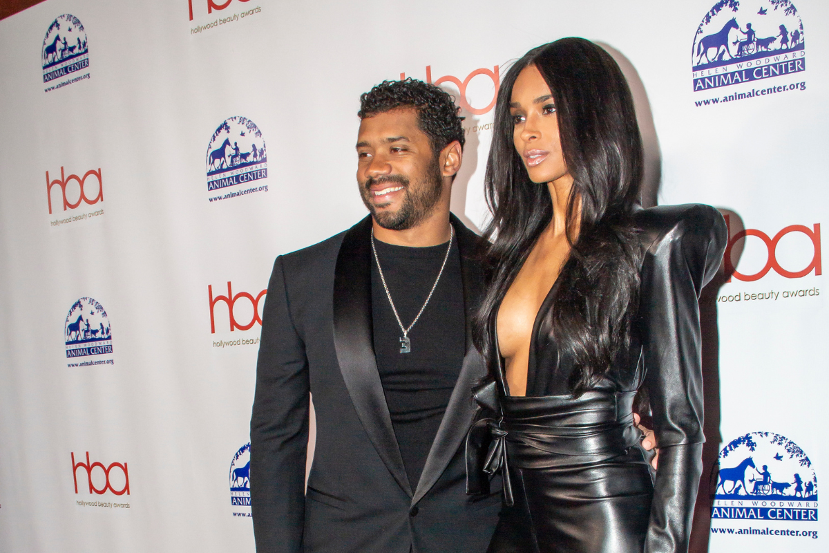 Russell Wilson and Ciara on a red carpet.