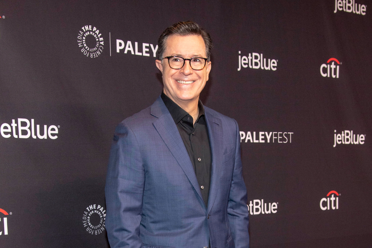 Stephen Colbert on a red carpet.