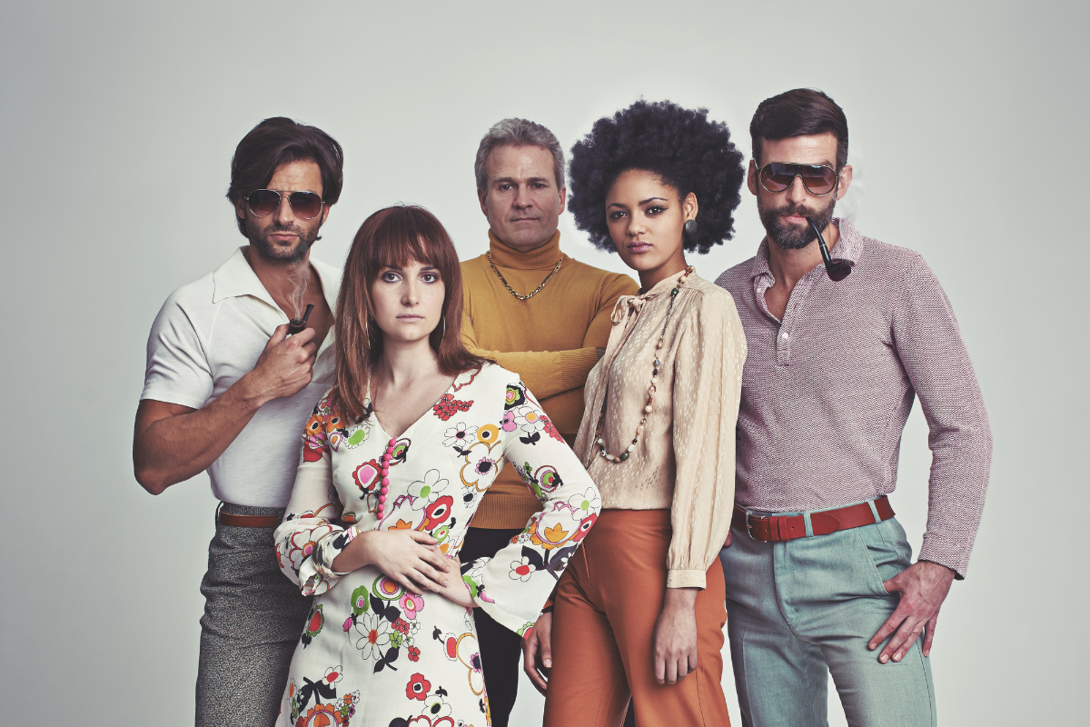 A group of people dressed in 1970s attire.