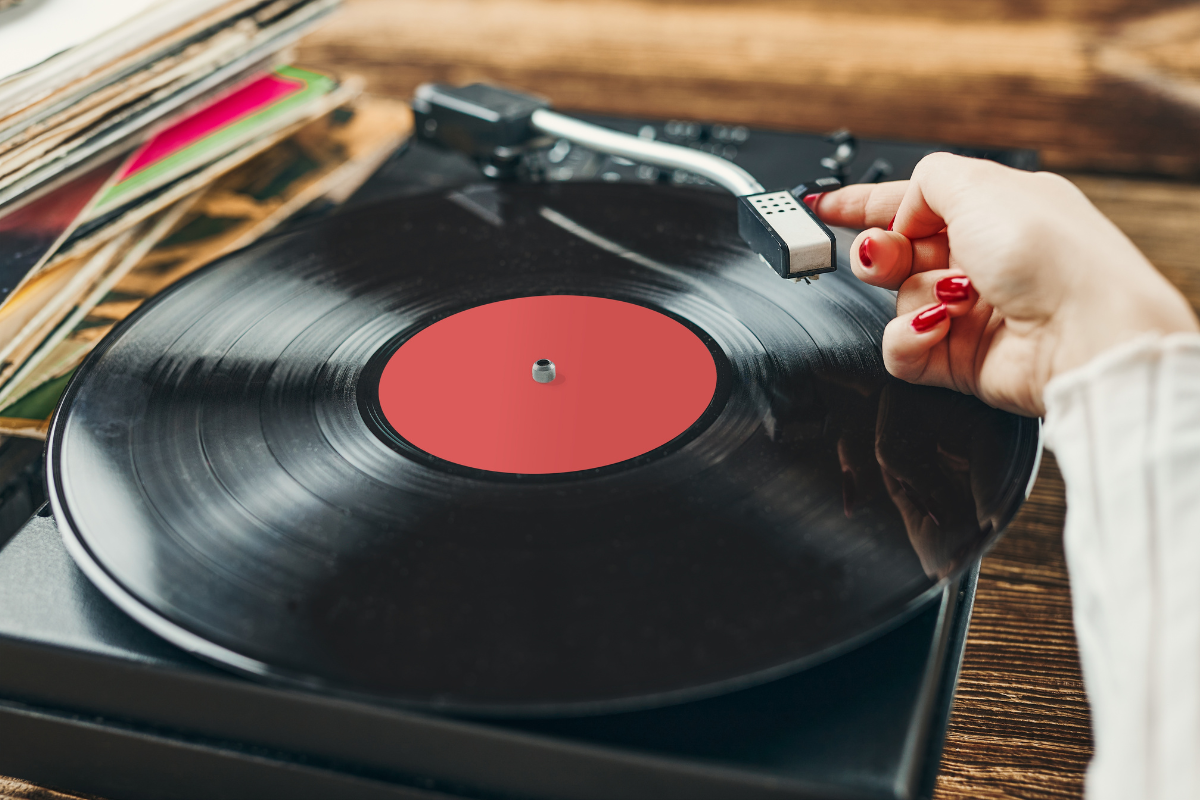 Someone playing a record on a record player.