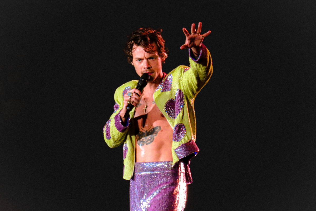 Harry Styles performing on stage.