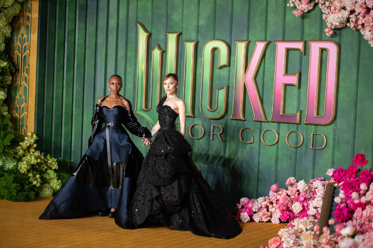 Ariana Grande and Cynthia Erivo on a red carpet.