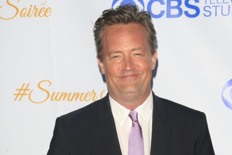Matthew Perry on a red carpet.