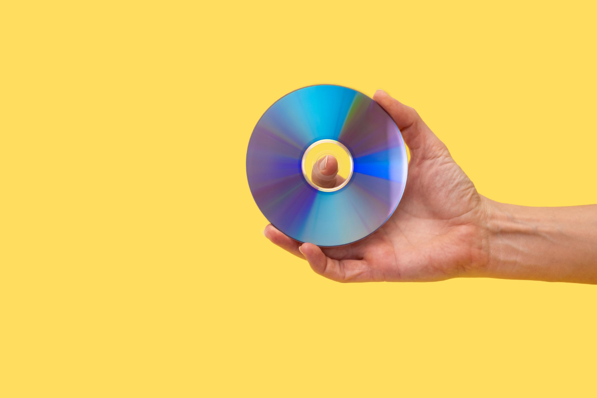 A person holding a CD.